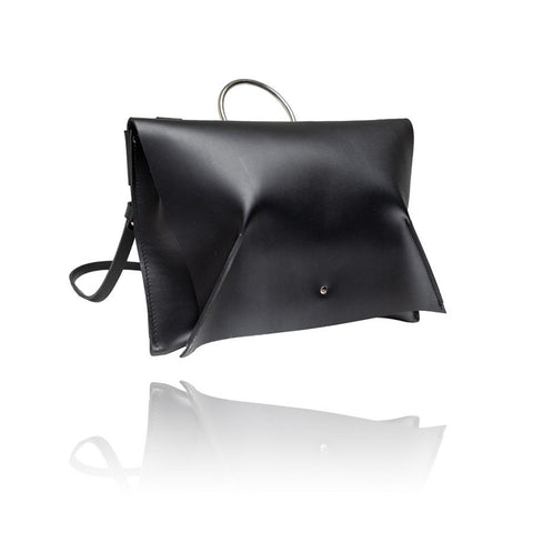 3. Side view of black leather Handbag Kamila by PYKOK with magnetic closure, studio shot
