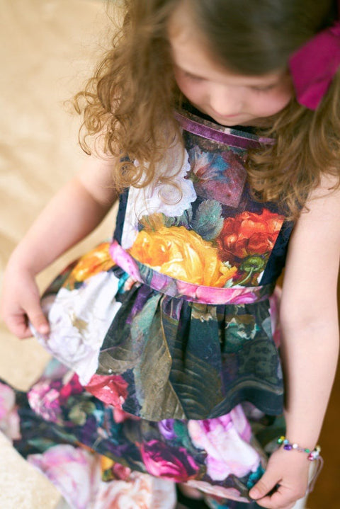 3. Close-up of Hortensias Home Francine Black kids apron showing detailed dark floral print and layered design