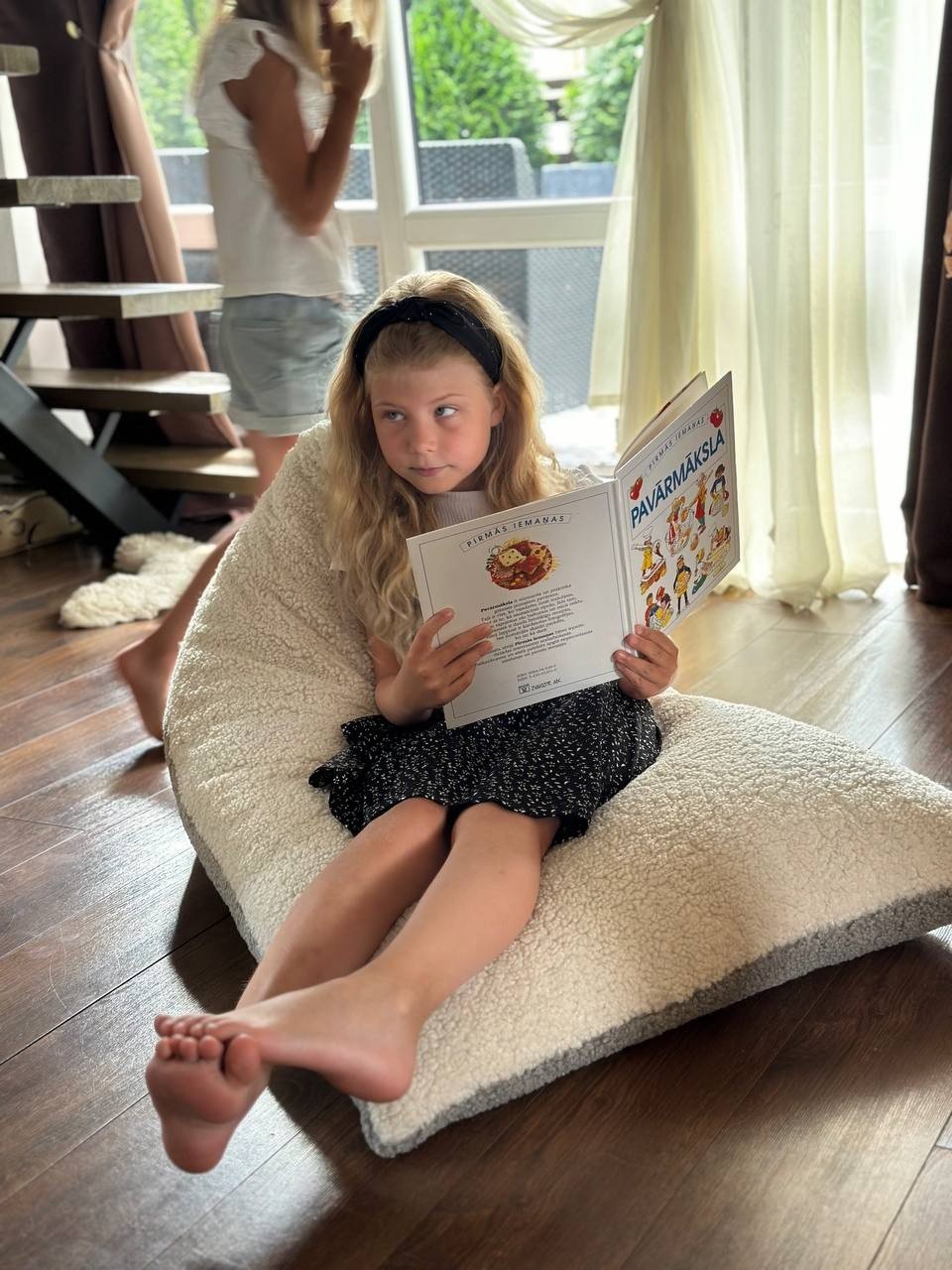 1. Luula Kids Bean Bag Chair in a bright playroom with wooden furniture and natural light