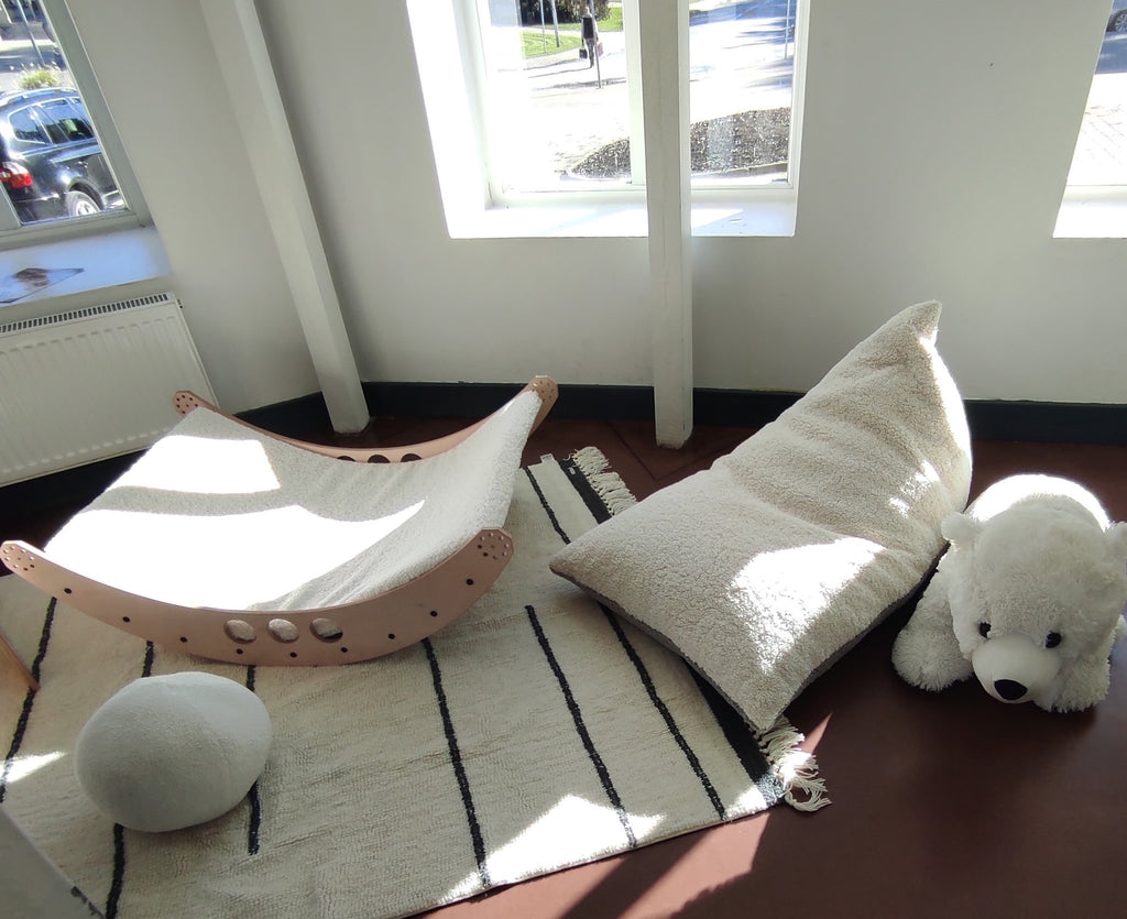 1. Luula Kids Bean Bag Chair in a playroom setting with wooden furniture and natural light