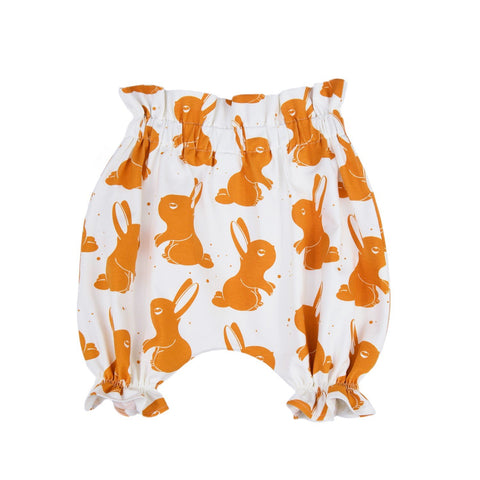 2. Kids' bloomers with orange rabbit print on white cotton fabric, featuring ruffled leg openings and elastic waistband, shown in studio setting