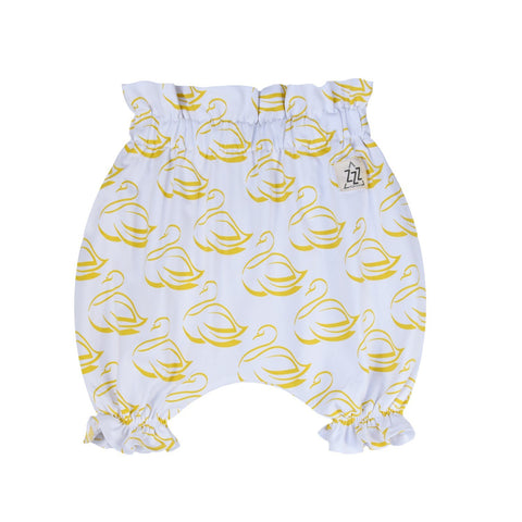 3. Studio shot of white bloomers with golden-yellow swan print, ruffled leg openings, and elastic waistband on white background