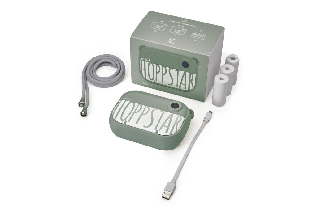 4. Green Hoppstar camera with packaging and accessories on white background
