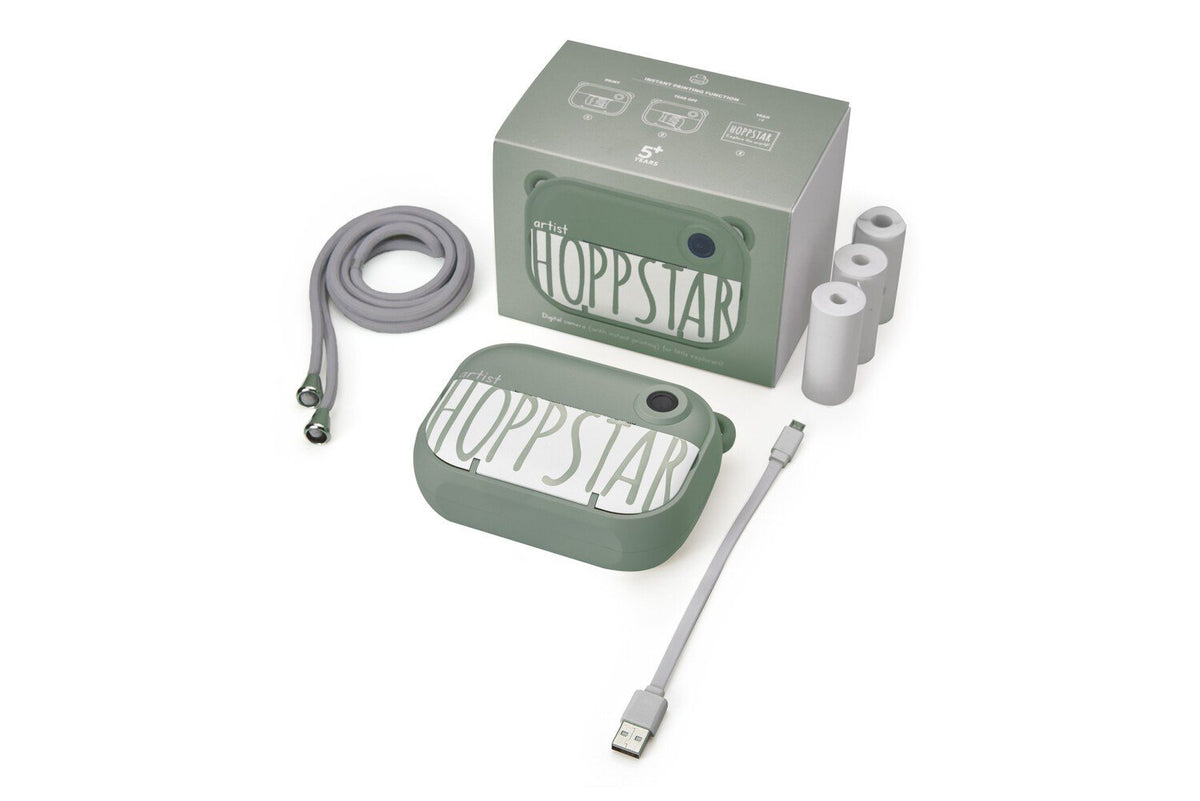 4. Green Hoppstar camera with packaging and accessories on white background