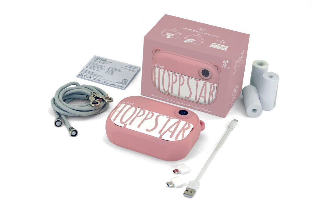 4. Pink Hoppstar camera with packaging and accessories on white background
