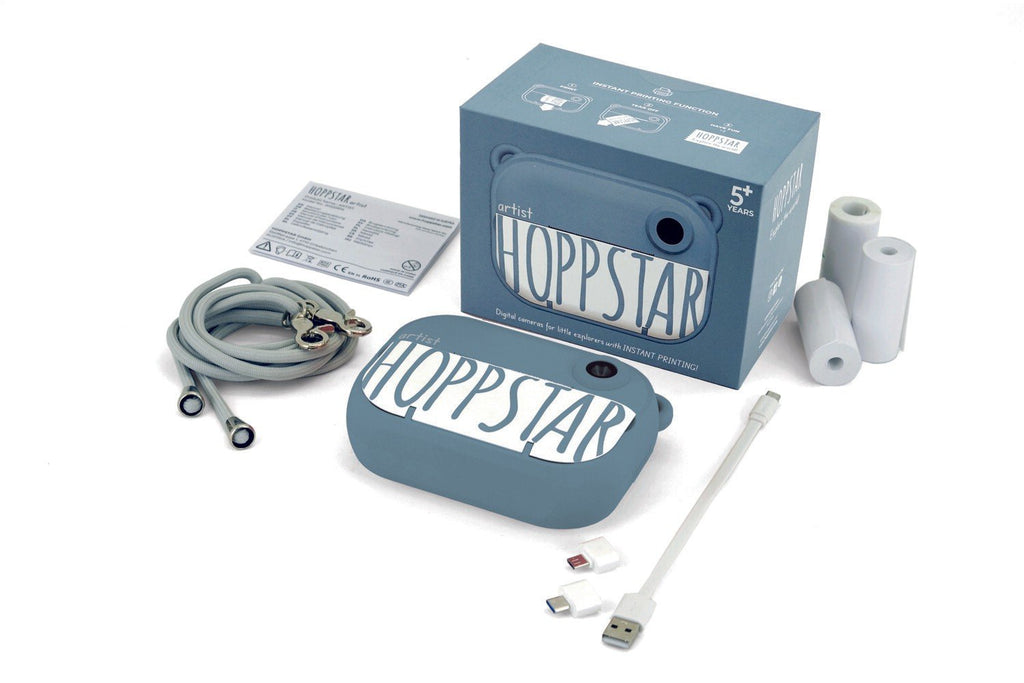 4. Blue Hoppstar camera with packaging and accessories on white background