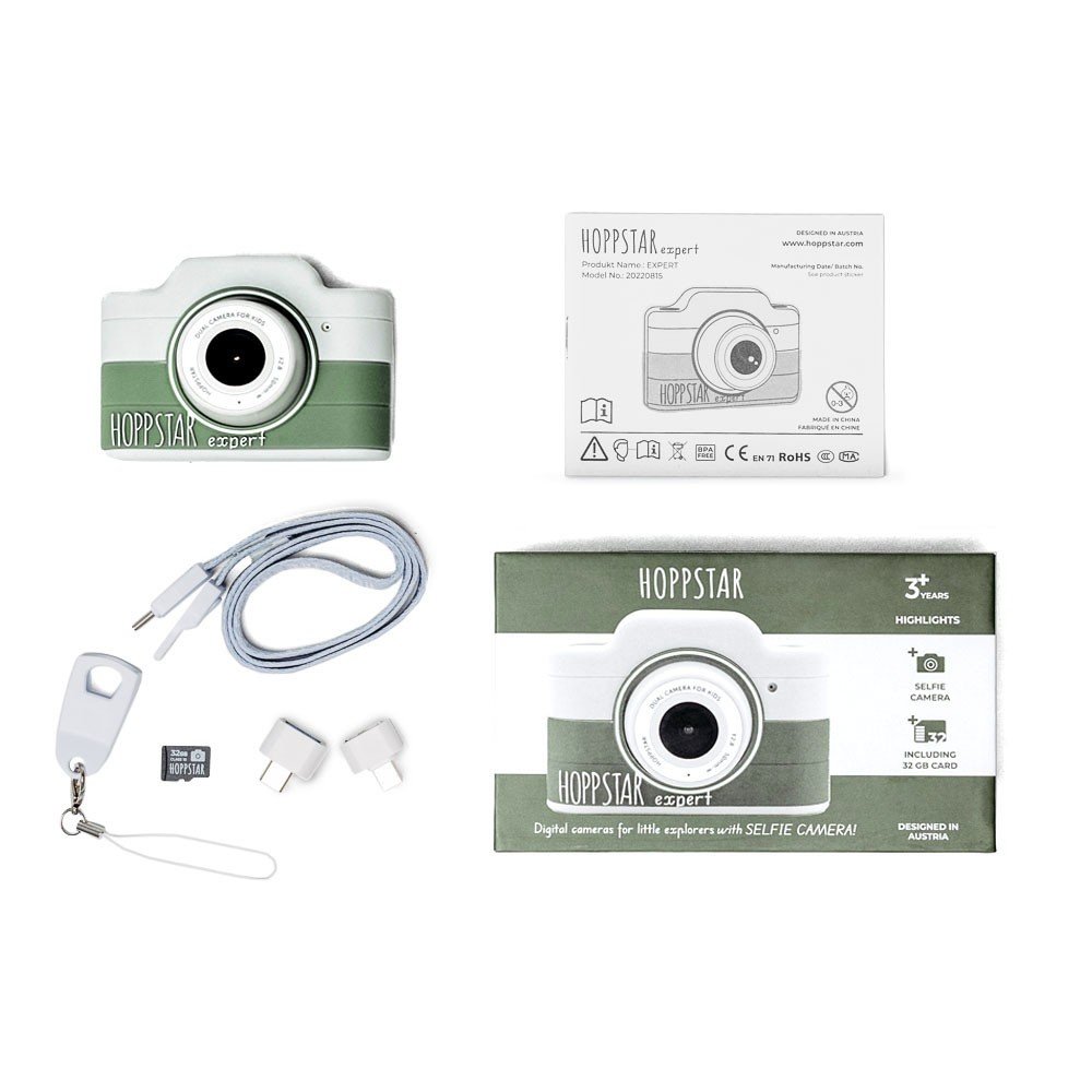 4. Flat lay of green Hoppstar Expert children's camera with packaging and accessories