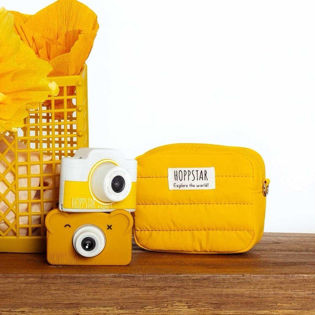 1. Yellow Hoppstar Expert camera with matching bag and basket on wooden surface