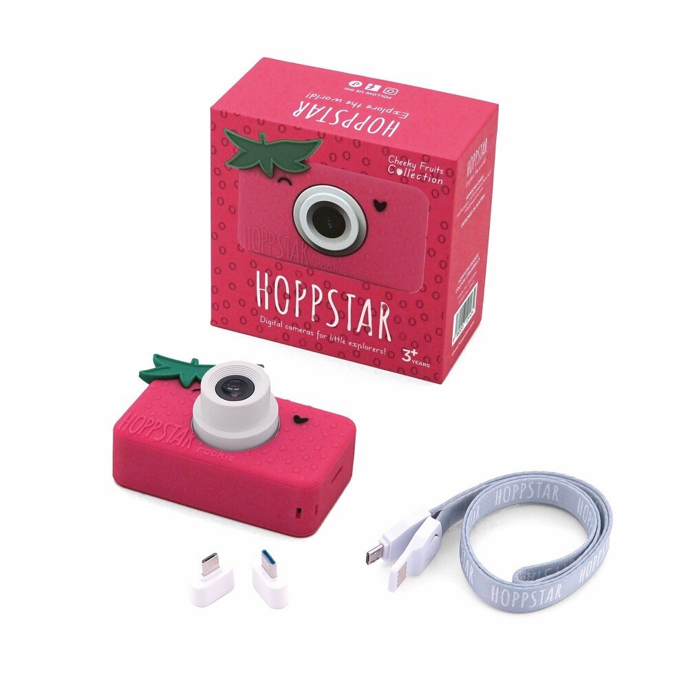 2. Pink Hoppstar Rookie camera with packaging, USB cable, and adapters on white background