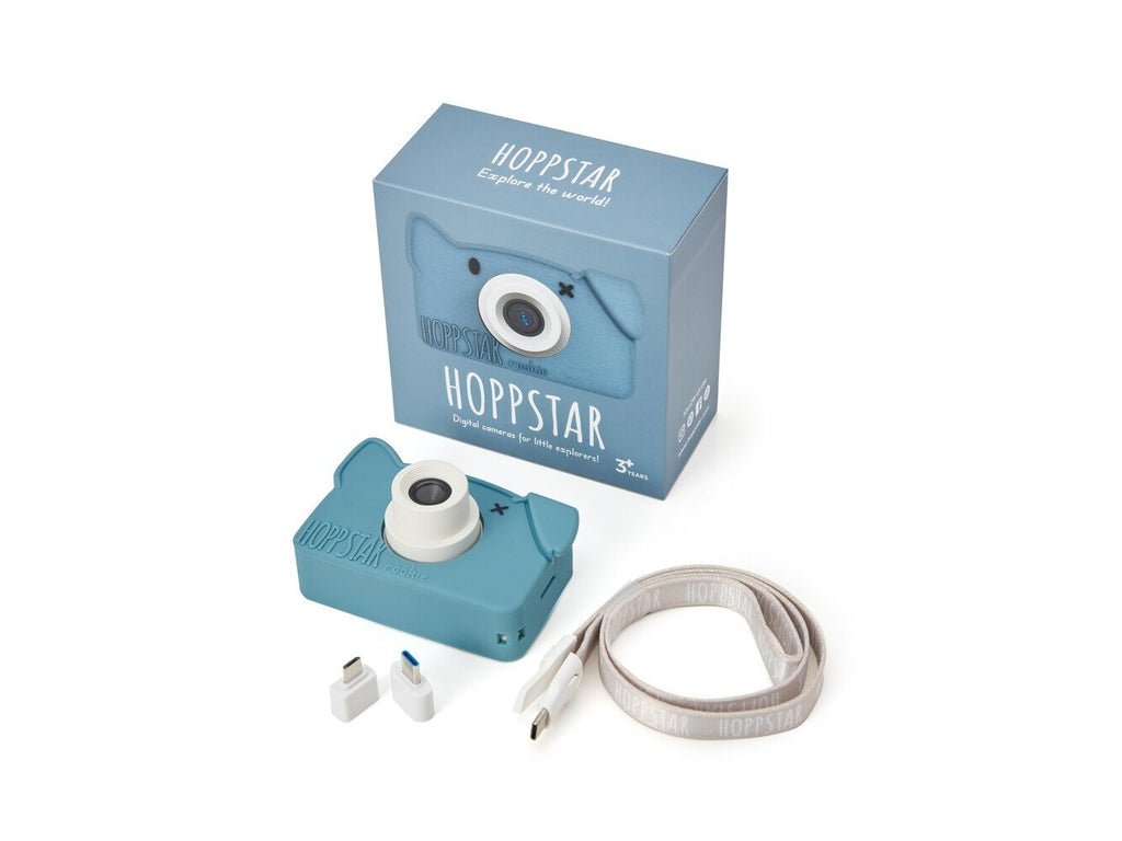 2. Blue Hoppstar Rookie camera with packaging, USB cable, and adapters on white background