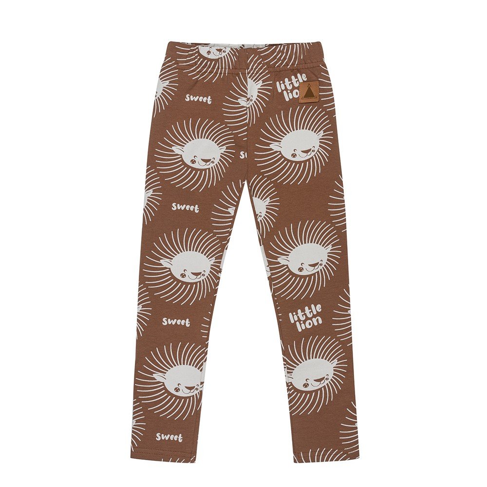 4. Flat lay of kids' cinnamon-colored leggings with playful white lion print and text 'sweet' and 'little lion', featuring elastic waistband, made from OEKO-TEX cotton by Zezuzulla