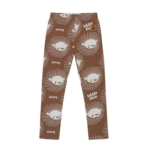4. Flat lay of kids' cinnamon-colored leggings with playful white lion print and text 'sweet' and 'little lion', featuring elastic waistband, made from OEKO-TEX cotton by Zezuzulla