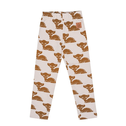 2. Kids' leggings with brown deer pattern on white background, featuring elastic waistband and Zezuzulla logo patch, made from OEKO-TEX cotton and elastane blend.