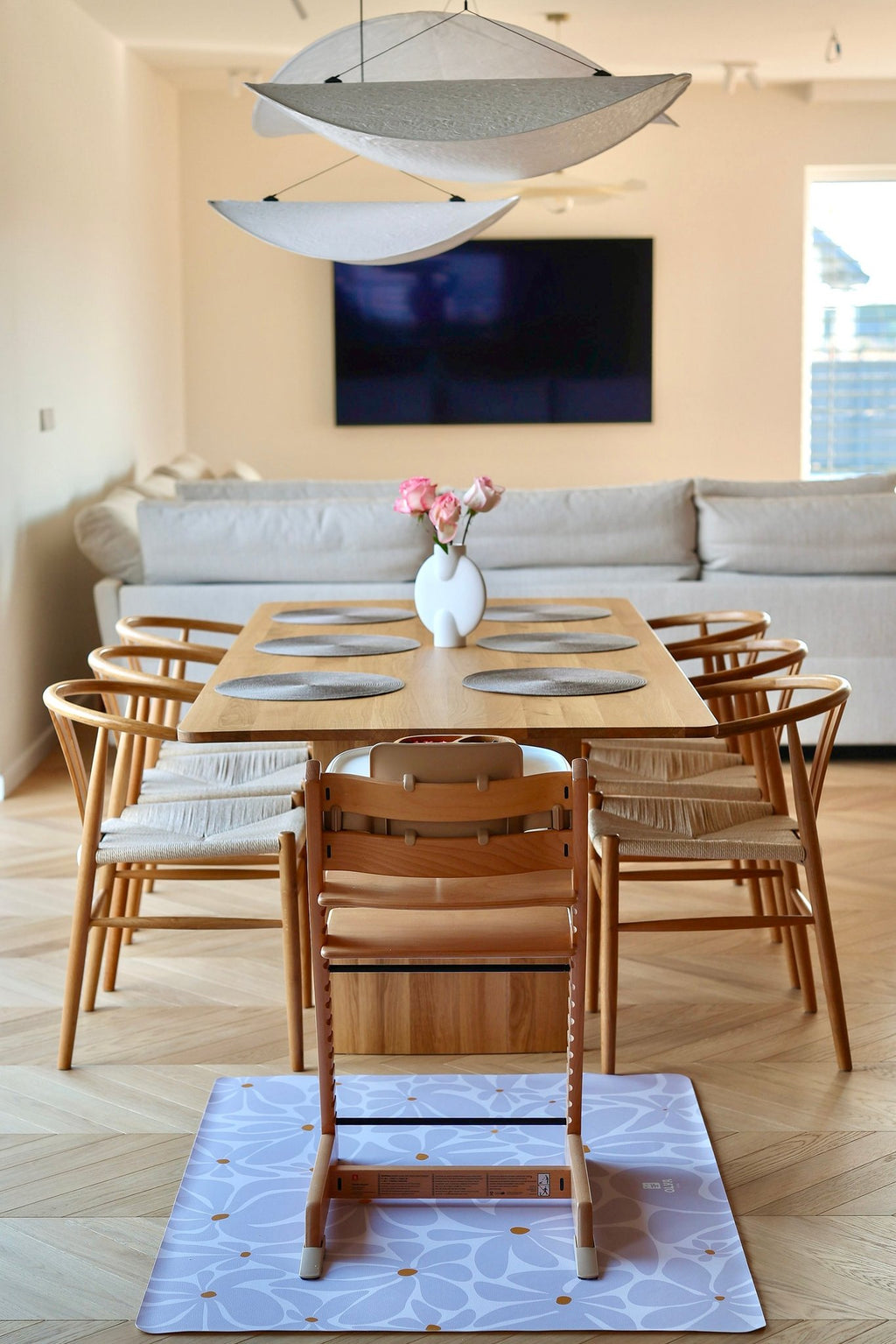8. Dining room setup with lavender daisy-patterned floor mat under high chair