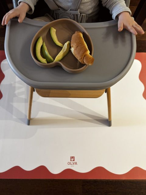 3. Close-up of high chair with food on tray over OLYA KIDS red-framed waterproof floor mat