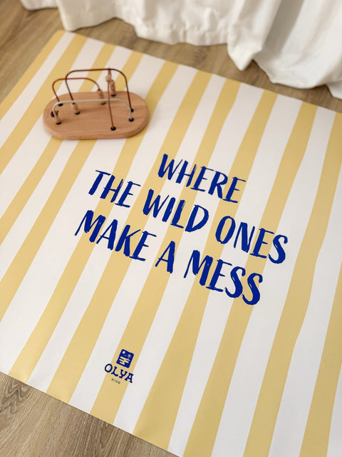 4. Yellow and white striped floor mat with text 'Where the wild ones make a mess' and wooden toy, OLYA KIDS logo visible