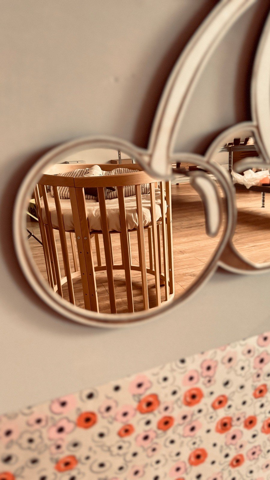5. Close-up of cherry mirror reflecting nursery interior, gold-tinted acrylic and plywood frame