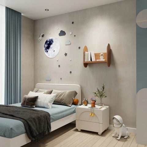 1. Kids' room with wall-mounted wooden bookshelf holding books and toy, next to bed with moon and star wall decor