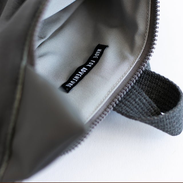 12. Interior view of Muni wolf backpack, showing lining and label