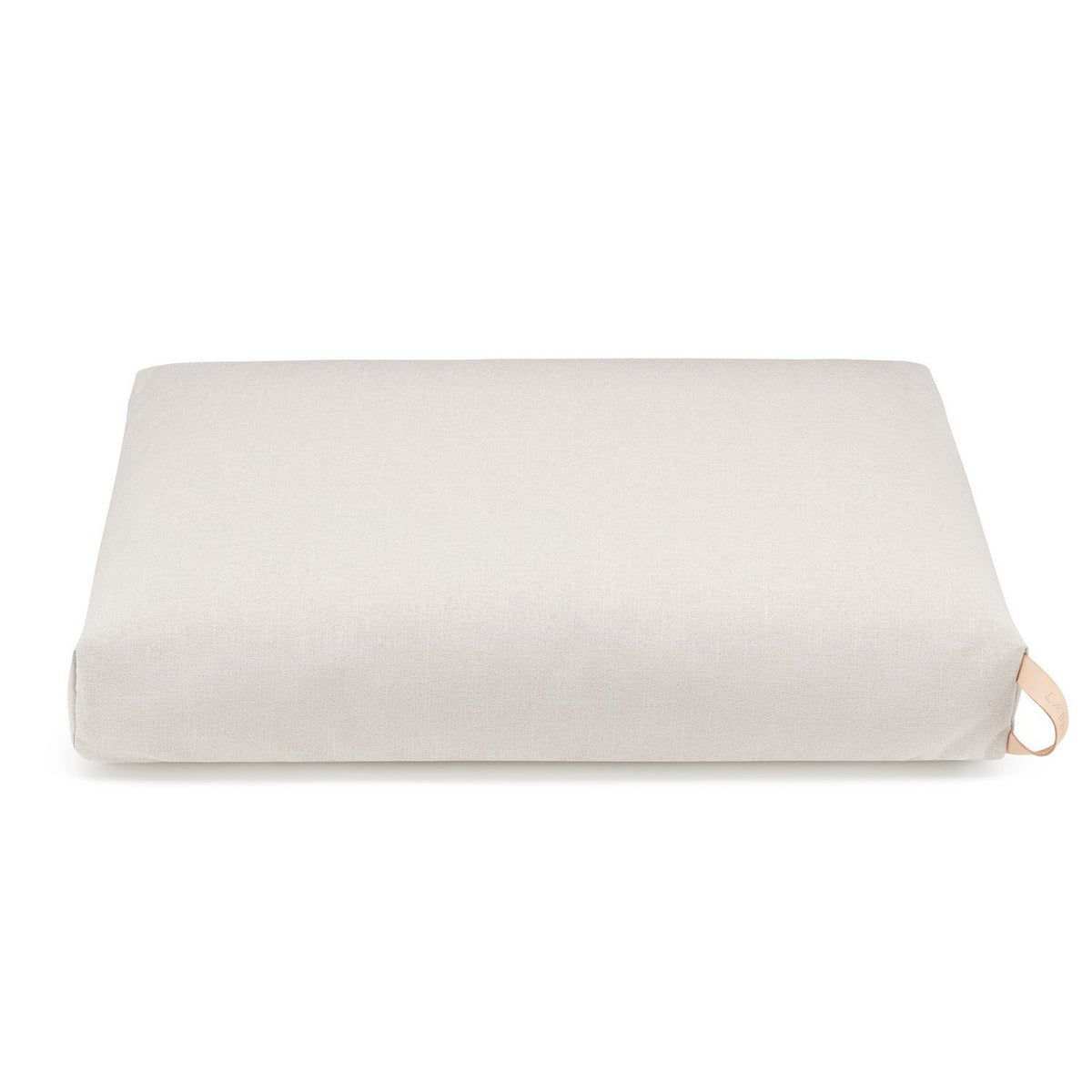 2. Light beige Kiima dog cushion with natural leather handle on white background, showcasing minimalist design and premium materials