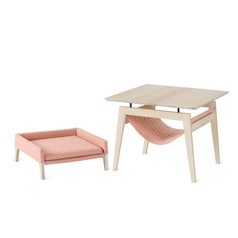 2. Studio shot of Labbvenn Kikko table and Lulu bed for cats in raspberry color, featuring ash wood construction and modern design