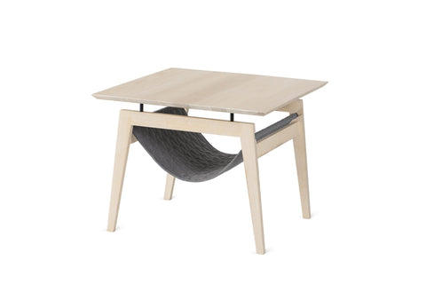 2. Scandinavian-style Kikko table in light wood with anthracite quilted fabric hammock, designed for dual use as coffee table and cat resting spot, shown in studio setting