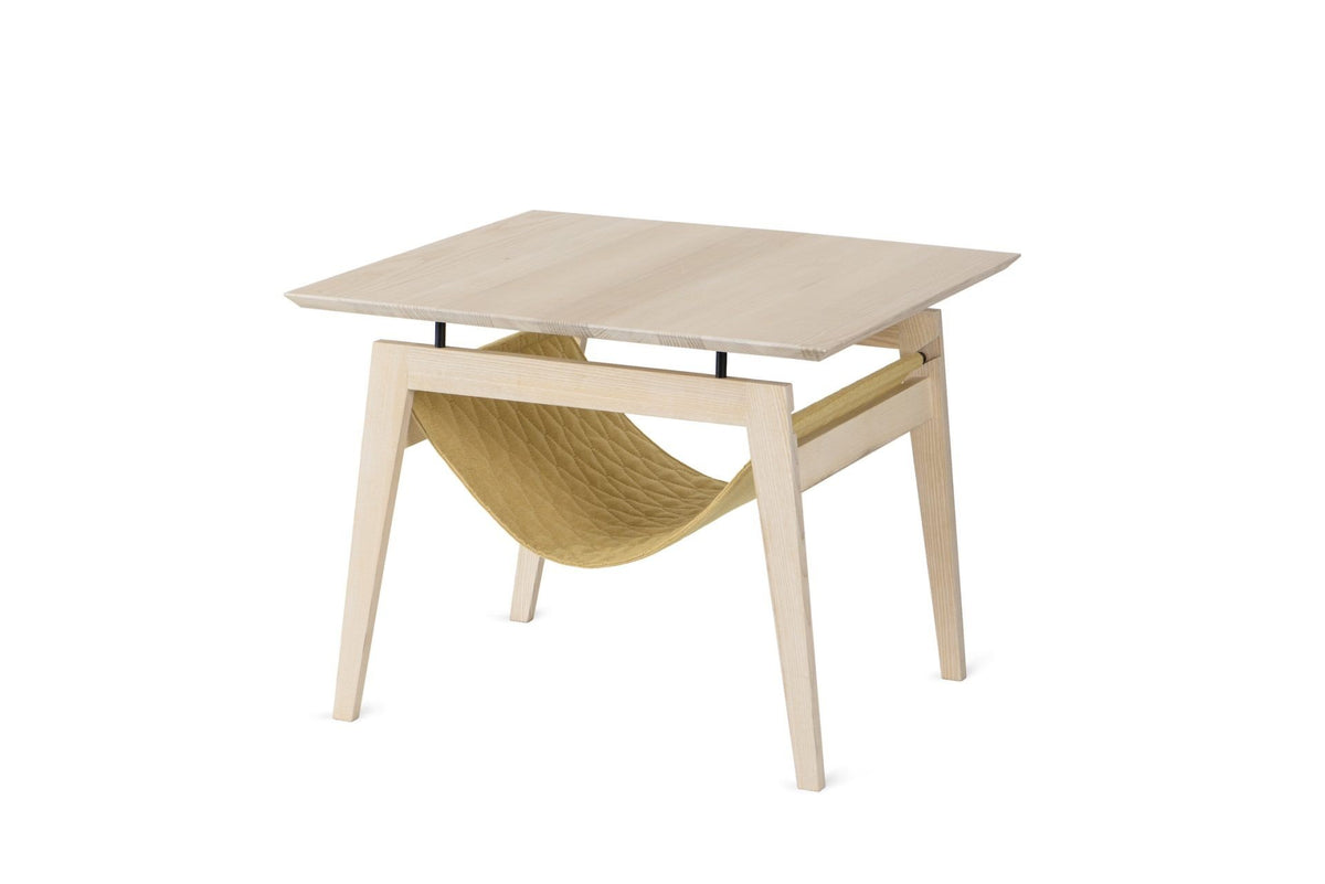 1. Scandinavian-style Kikko table in honey color with quilted fabric hammock for cats, featuring minimalist design and metal elements, shown in a studio setting.