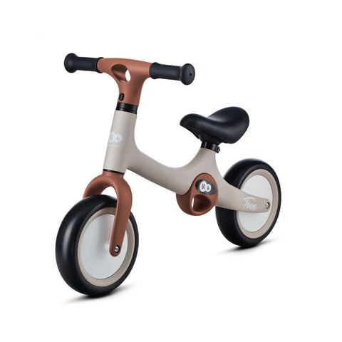 2. Beige Kinderkraft TOVE balance bike with black seat and foam wheels on white background