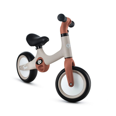 3. Side view of beige Kinderkraft TOVE balance bike with black seat and foam wheels