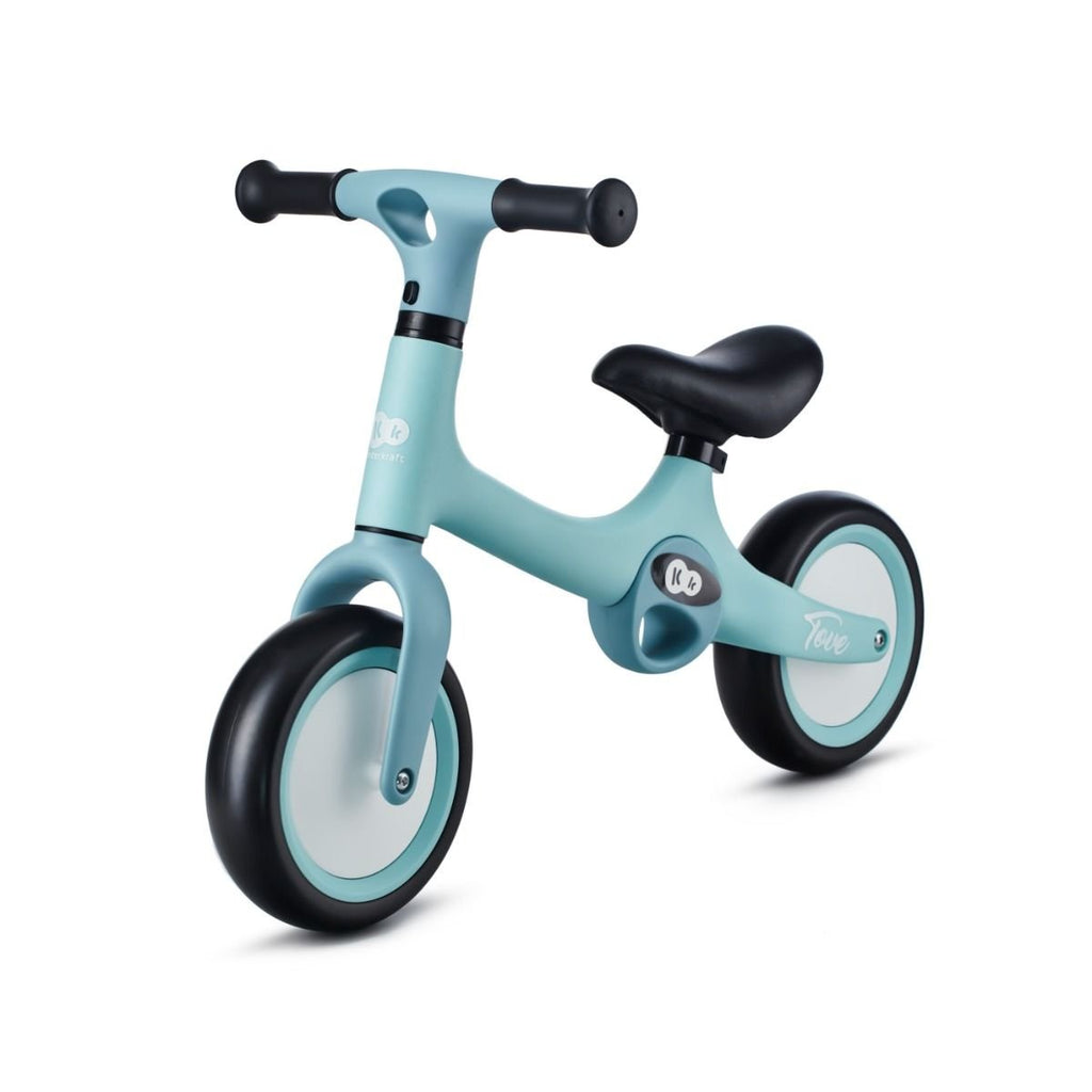 2. Mint green Kinderkraft TOVE balance bike with black seat and foam wheels, shown in side view on white background