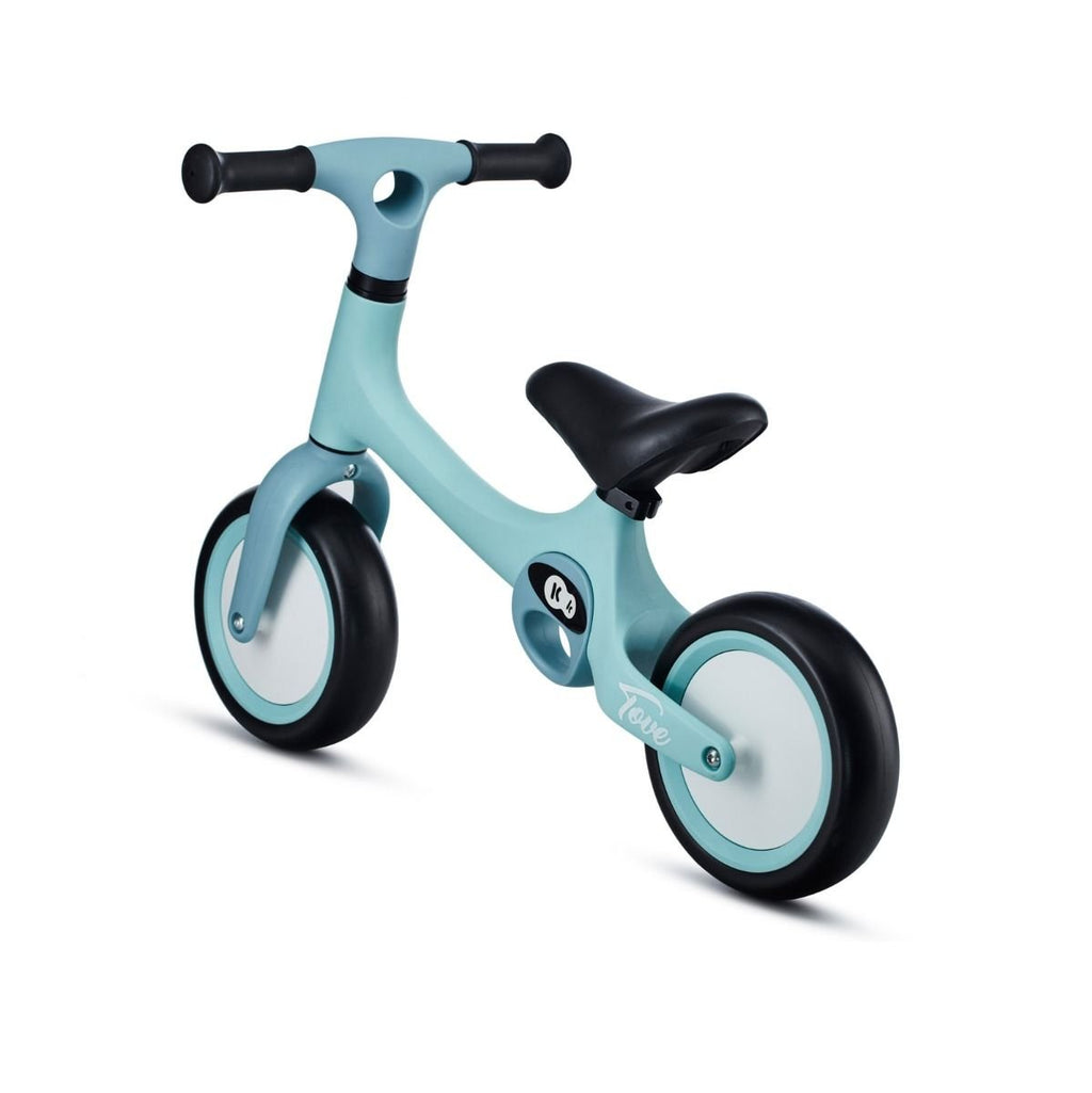 7. Angled view of mint green Kinderkraft TOVE balance bike with black seat and puncture-resistant wheels