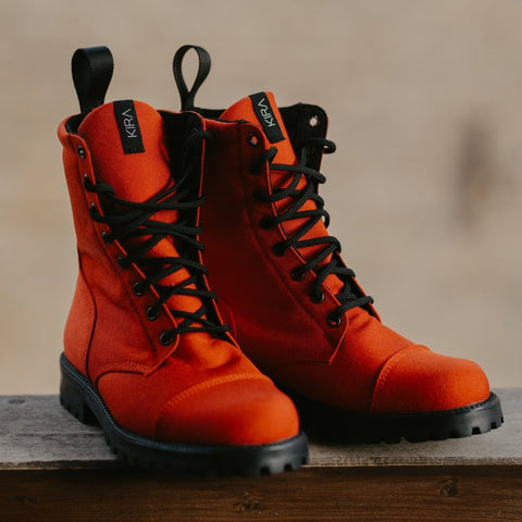 2. Studio shot of KIRA 5.0 red boots with black laces and deep tread rubber sole