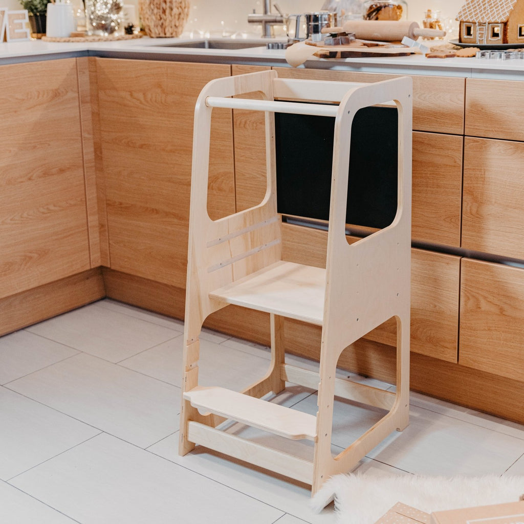 2. Natural wood Montessori kitchen helper tower in modern kitchen setting
