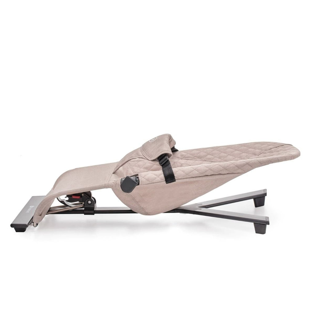 3. Side view of beige Kinderkraft MIMI baby bouncer in fully reclined position