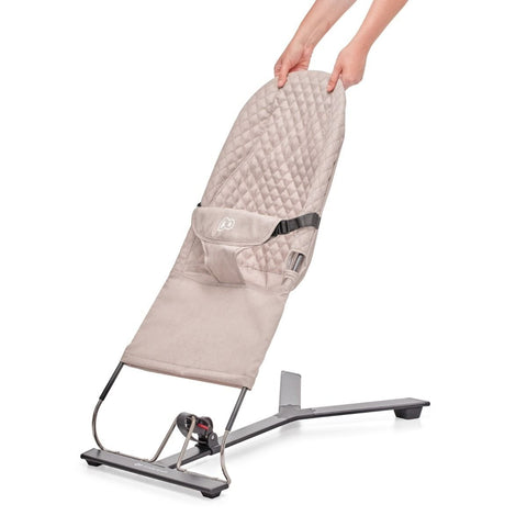 3. Close-up of beige Kinderkraft MIMI baby bouncer showing adjustable backrest being lifted by hands