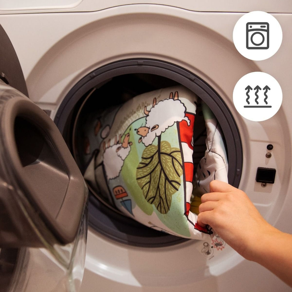 6. Kinderkraft Smartplay Sea playmat being placed in washing machine for easy cleaning