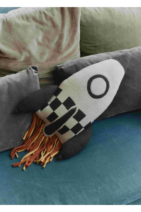 1. Knitted rocket pillow in natural and dark gray with colorful fringes on a blue sofa with green and gray cushions