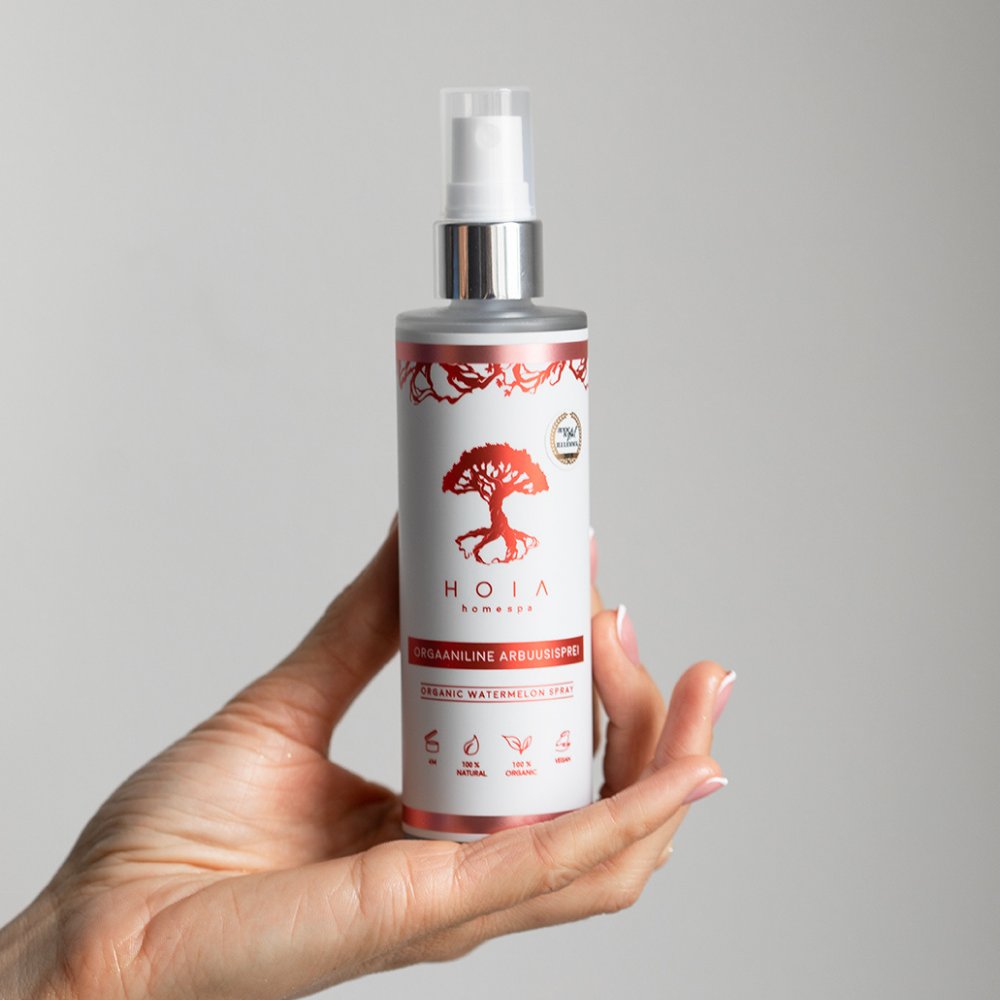 1. HOIA homespa Organic Watermelon Spray held in hand, showcasing eco-friendly packaging and natural ingredients