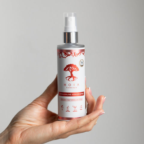 1. HOIA homespa Organic Watermelon Spray held in hand, showcasing eco-friendly packaging and natural ingredients