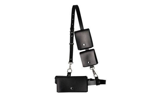 5. Flat lay of unisex leather body harness Kora No3 by PYKOK, showing belt, shoulder strap, mini bags, and chain