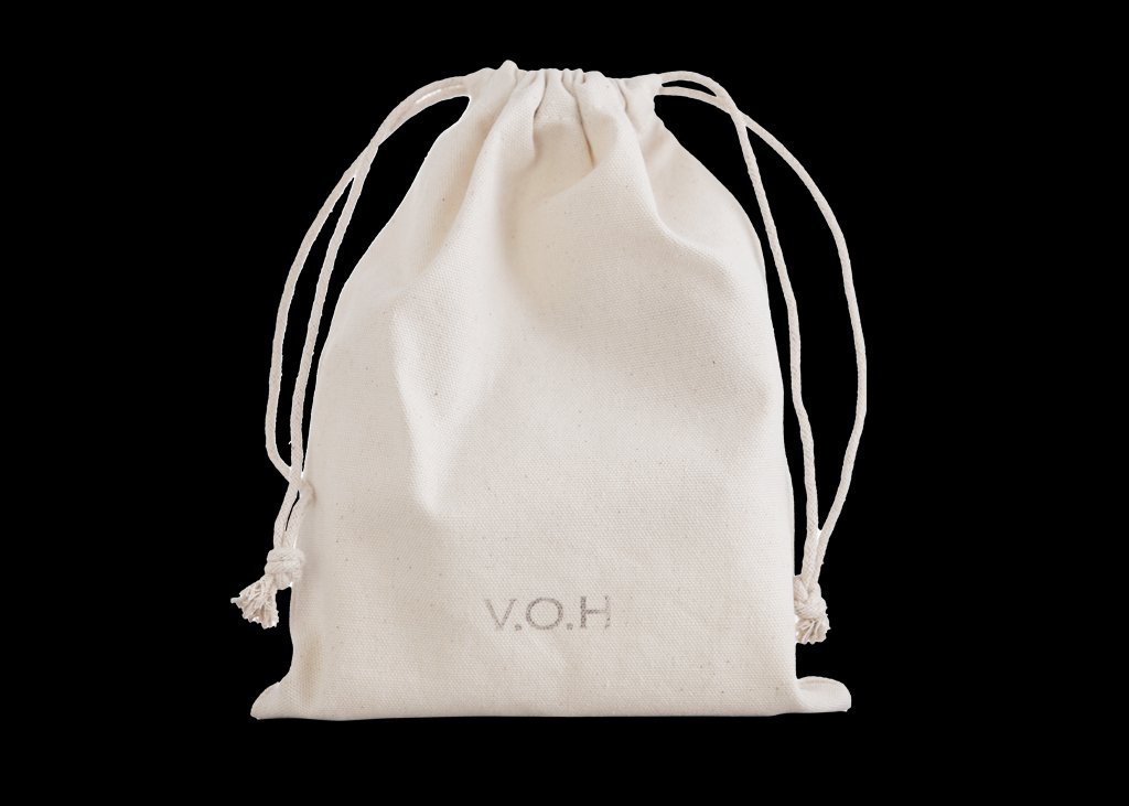 8. V.O.H solid beauty products stacked artistically on a natural surface