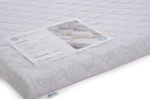 2. Close-up of KOTTO Dreemsy crib mattress with product label and jacquard pattern
