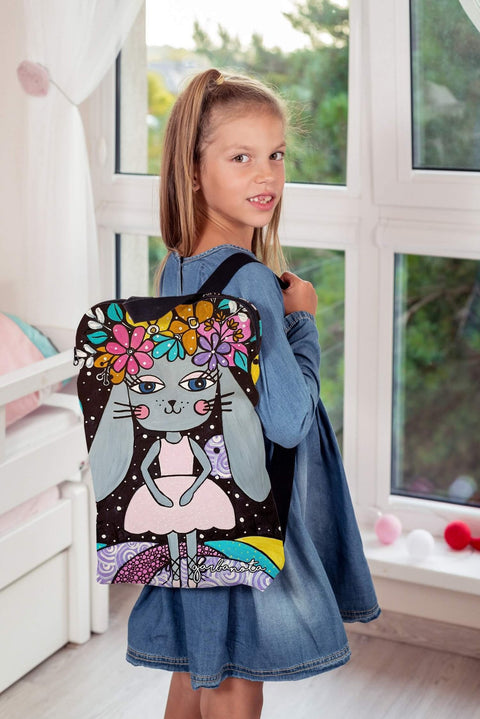 1. Girl wearing Garbanota kids backpack with bunny girl print, shown in lifestyle setting