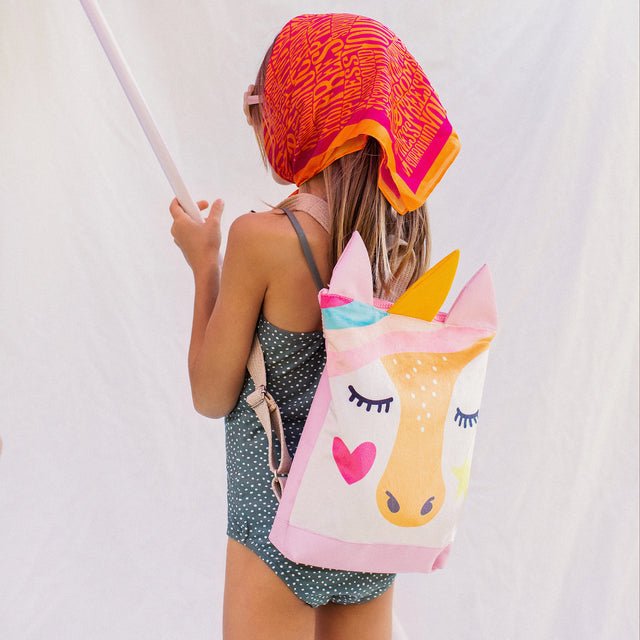 4. Close-up of MUNI Unicorn backpack design, featuring colorful unicorn face and sturdy fabric