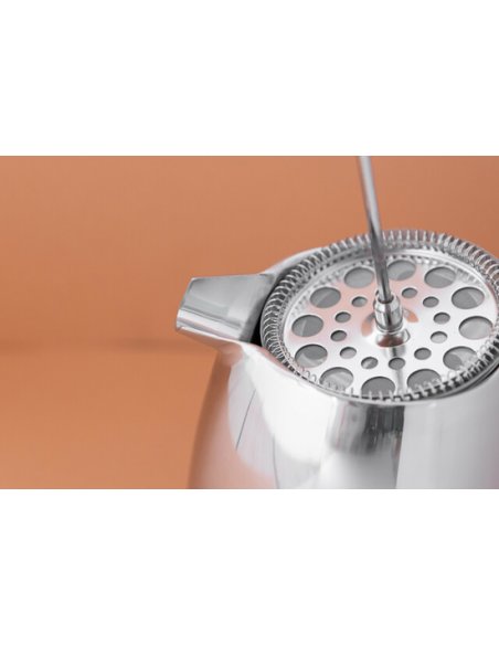 6. Close-up of La Cafetière coffee maker lid and filter on peach background