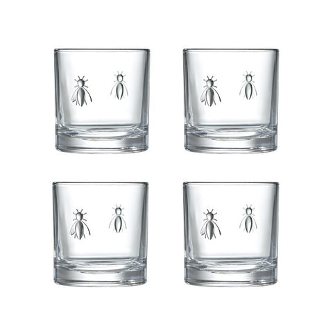 2. Set of four La Rochère Bee Whiskey Glasses with embossed bee design on a white background, showcasing the unique and playful style