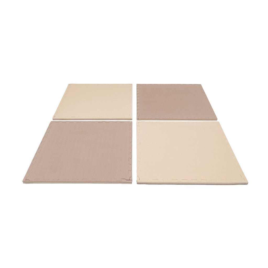 1. Four beige and dark beige foam puzzle mats arranged in a square on a white background