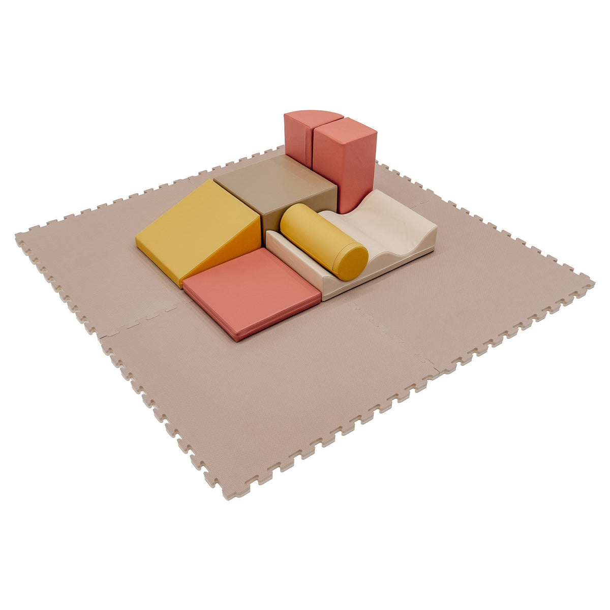 10. Beige foam puzzle mat with colorful foam blocks arranged on top