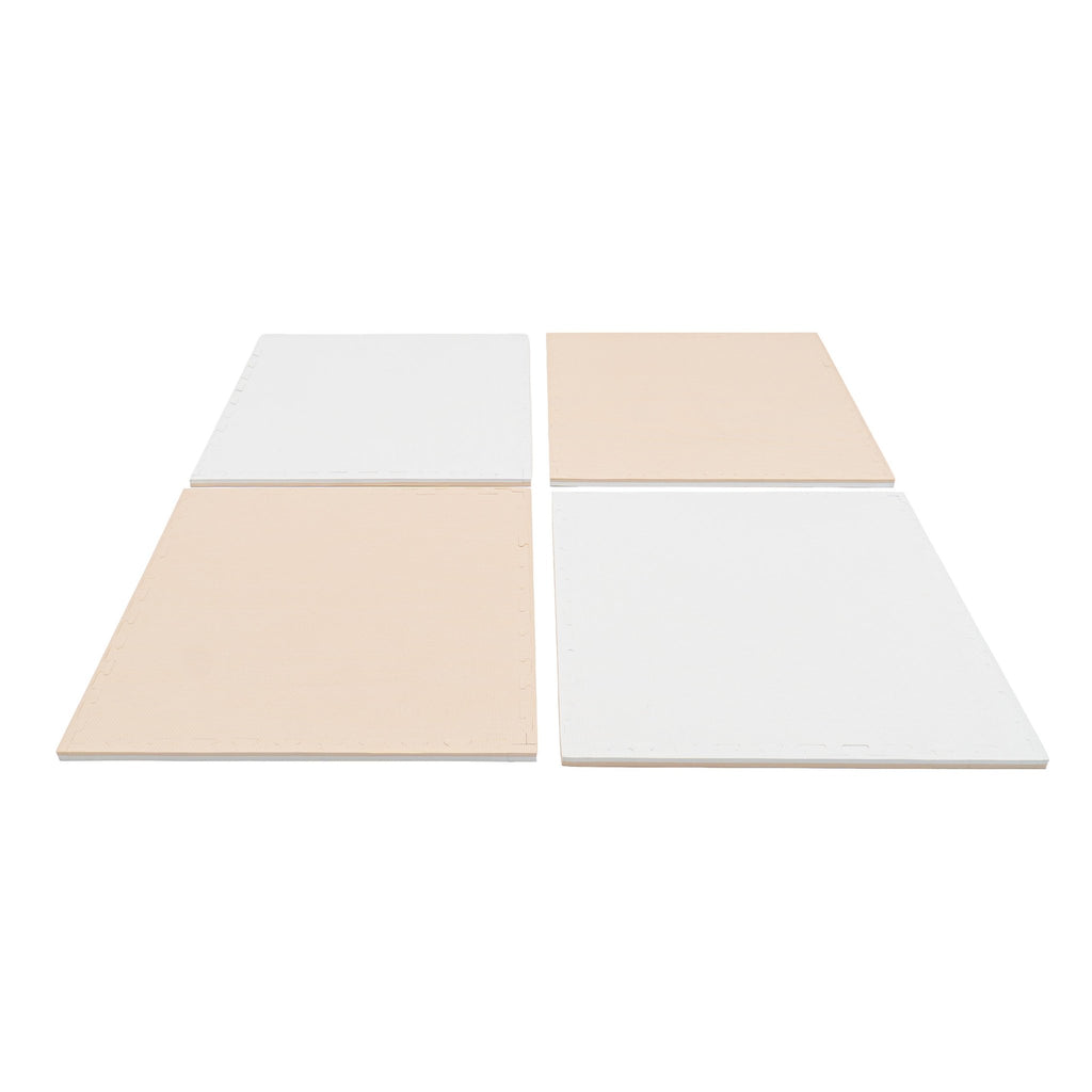 5. Four beige and white foam puzzle mats laid out in a row on a white background