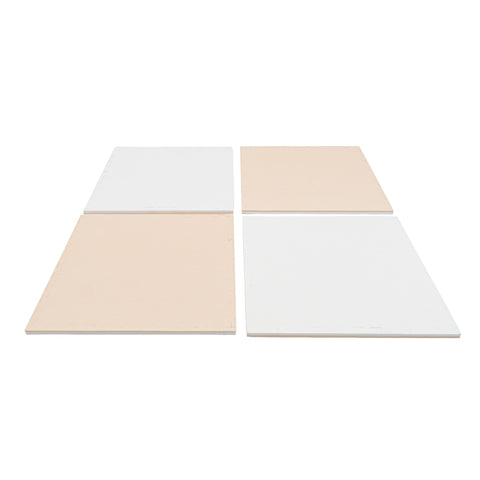 5. Four beige and white foam puzzle mats laid out in a row on a white background
